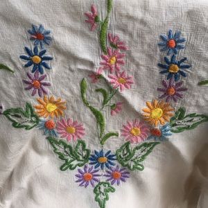 Vintage hand embroidered table cloth.  Spring floral pattern on four corners